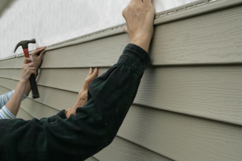 Siding being installed on a house